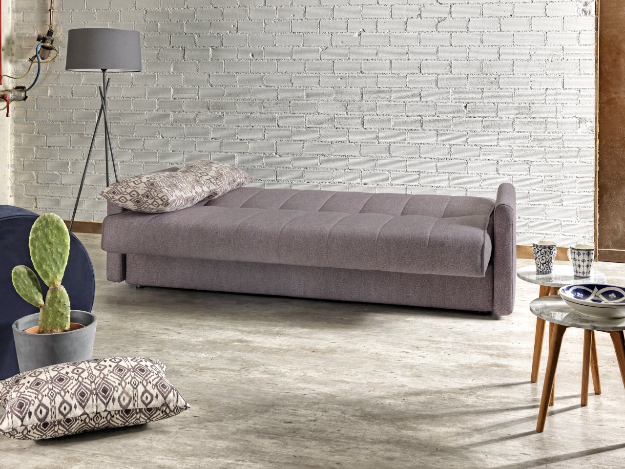 Four seater sofa bed with storage compartment that turns into a double bed, open as a bed.